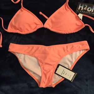 Never worn triangle top, scoop bottom bikini